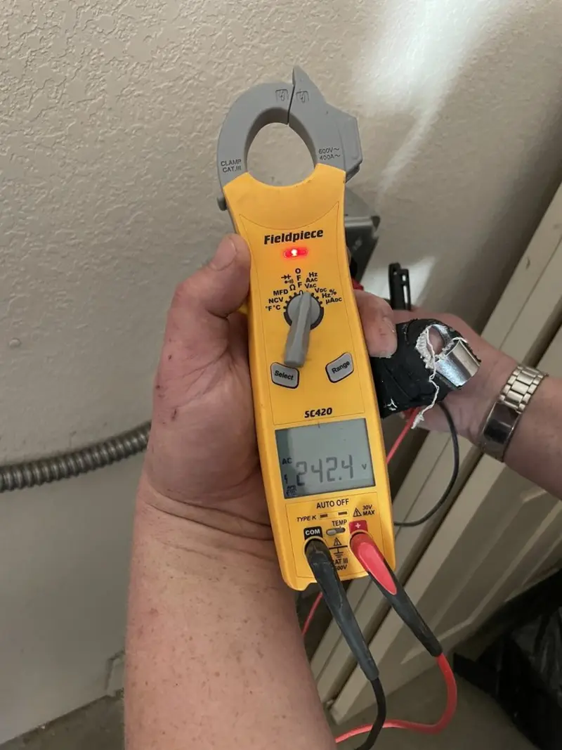 Voltage testing with clamp meter during Recessed Lighting Installation in Haddam